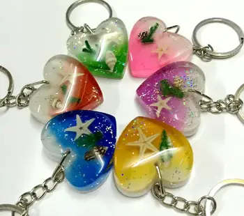 Doprava zadarmo yqtdmy 12 ks nových keychain v tvare s očarujúce farebné starfisn magic šperky